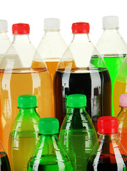 Assortment of bottles with tasty drinks, isolated on white