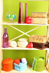 Beautiful white shelves with different home related objects,