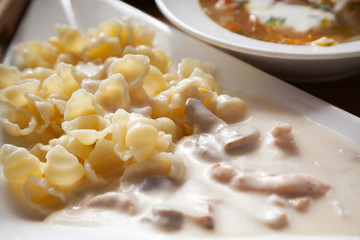 ravioli and white meat sauce with shallow depth of field