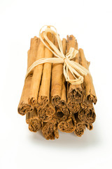 ceylon cinnamon sticks tied up on white background
