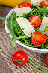 fresh salad from rucola, cherry tomatoes and parmesan cheese