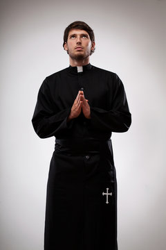 Young monk is giving gratitude to Holy Father