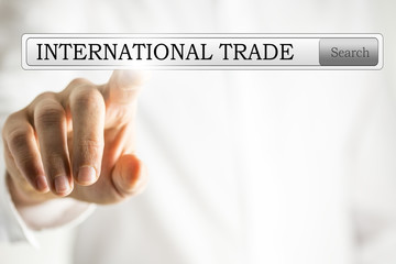 Hand clicking to search for international trade