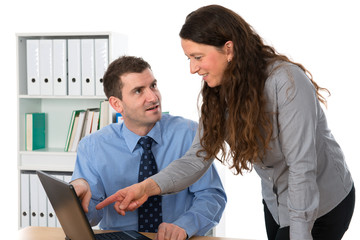man and woman in the office talking