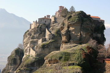 greek orthodox church and monastery on a pinnacle of rock in meteora