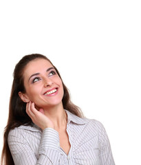 Fototapeta premium Smiling woman looking above on empty copy space isolated on whit