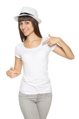 Smiling woman pointing at blank white t-shirt