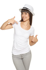 Woman pointing at herself and showing thumb up