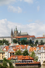 Naklejka na ściany i meble Prague castle over the roofs. Prague cityscape
