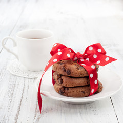 Fresh homemade chocolate cookies with cup of tea