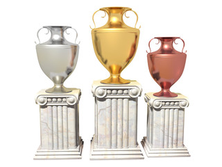 Gold, silver and bronze cups on a marble pedestal