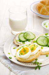 Fresh canapes with egg, cottage cheese, cucumber and herbs