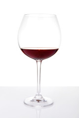 Wine glass with reflection, isolated on white