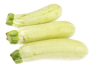 The fresh zucchini isolated on white background.