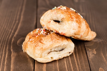 Mini neapolitans chocolate on wood background