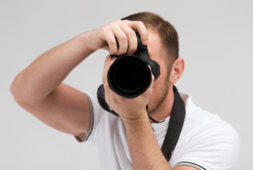 male photographer taking picture with camera