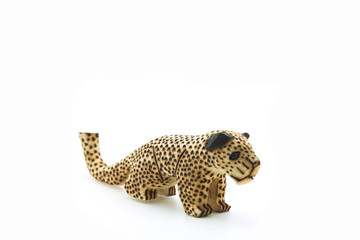 wooden mini figure of a leopard isolated on white background