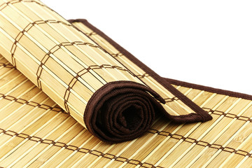 Rolled bamboo mat on a bamboo mat