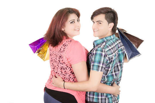 couple with shopping bags in variety of colors.