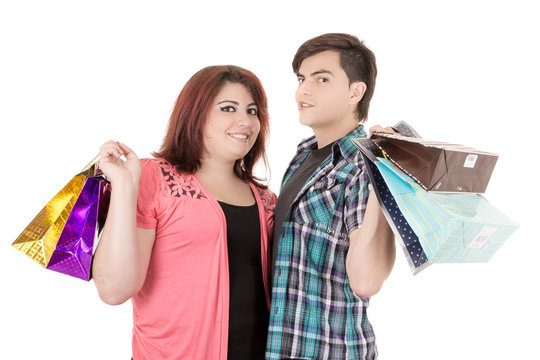 couple with shopping bags in variety of colors.