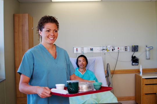 Nurse with meal tray