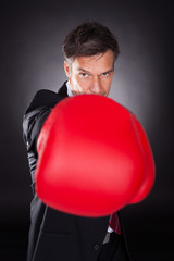 Businessman In Red Boxing Gloves