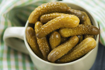 Close-up of pickled cucumbers in a jar, horizontal shot