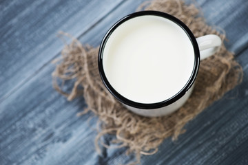 Milk in a cup, view from above, horizontal shot