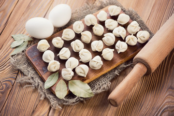 Russian traditional pelmeni and cooking ingredients