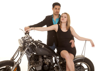 Fototapeta na wymiar woman sit motorcycle man behind both look