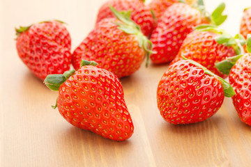 Strawberry over wooden background
