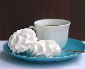 cup of coffee with merengues