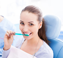 Female patient brushing her teeth