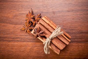 cinnamon sticks and star anise on a wooden background