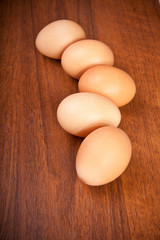 chicken eggs on wooden background