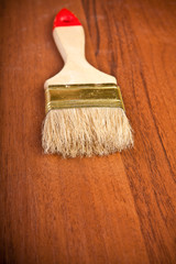 paint brush on wooden background closeup