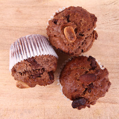 Chocolate muffins on a wooden background
