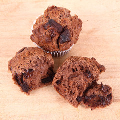 Chocolate muffins on a wooden background