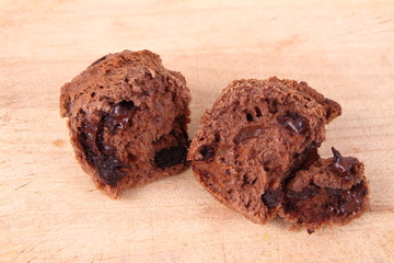 Chocolate muffins on a wooden background