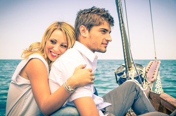 Fototapeta na wymiar Couple in Love - Honeymoon on the sailing Boat