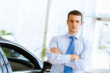 Fototapeta premium Businessman near car