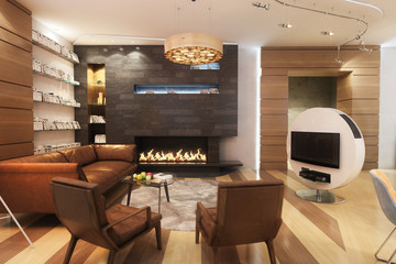 Living Room With Leather Sofa And Armchair Near The Fireplace