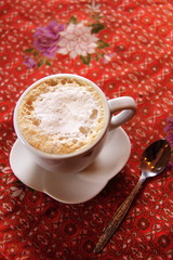 hot latte coffee red table