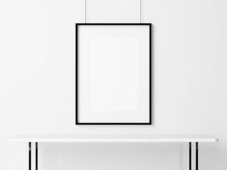 White table and empty picture frame