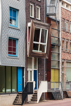 Row of Dutch contemporary canal houses in Amsterdam
