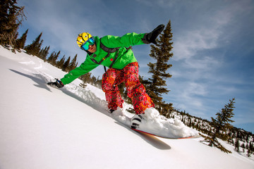 Snowboarder doing a toe side carve