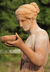 woman carrying dish - classic sculpture