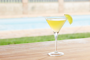 Classic daiquiri cocktail by a pool outdoors