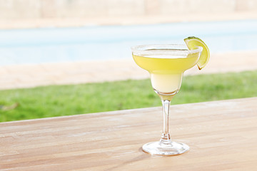 Margarita cocktail by a pool outdoors