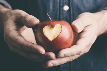 hands with apple